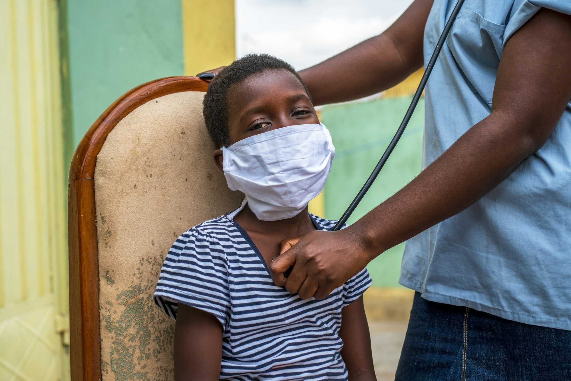 Closeup shot of a boy getting a checkup by a doctor