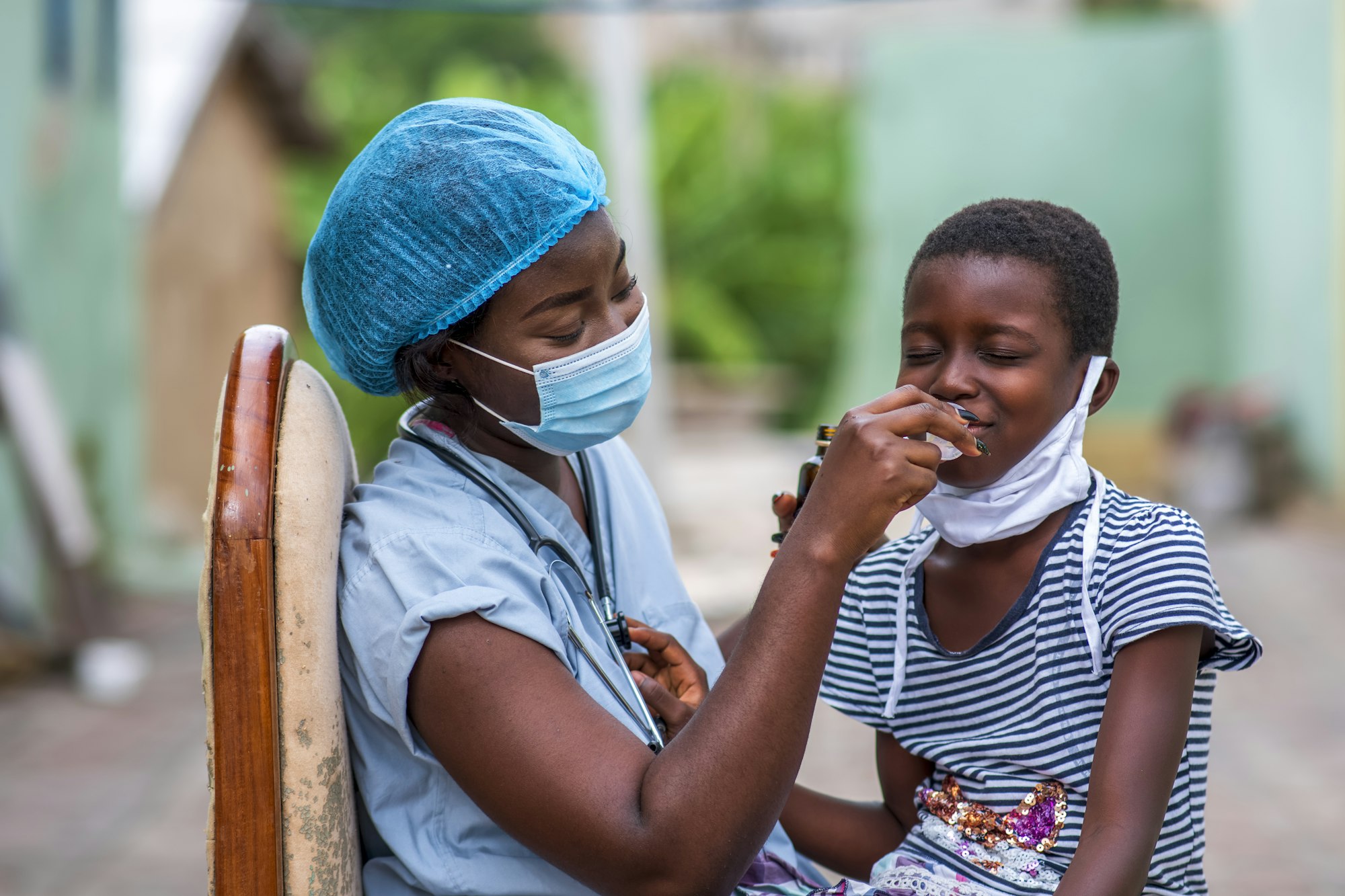 Closeup shot of a boy getting a checkup by a doctor